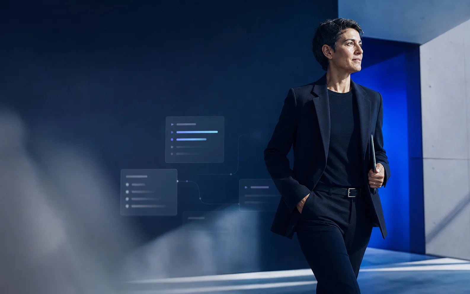 A professional moving confidently through a cobalt architectural workspace